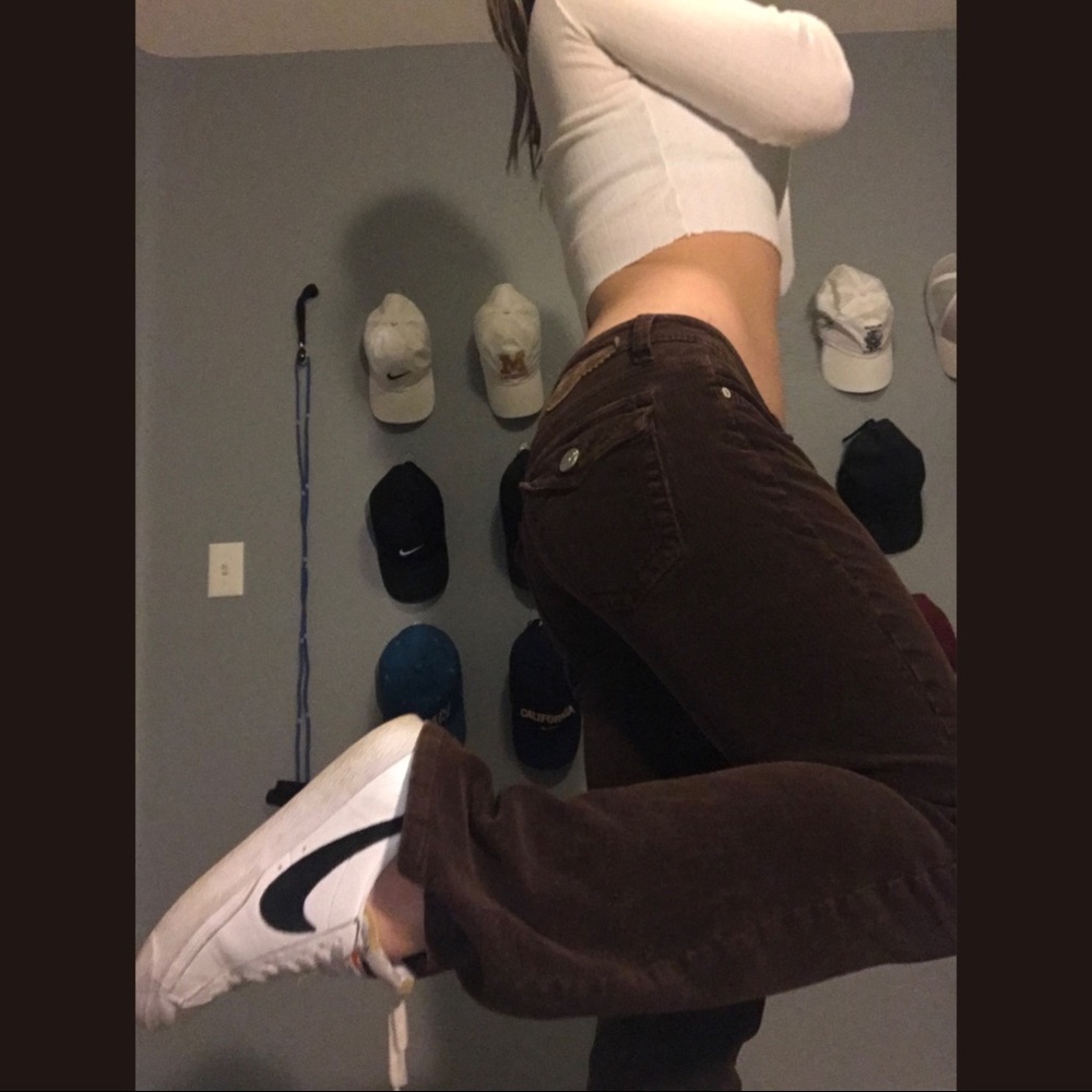 Brown low-rise corduroy bootcut jeans.